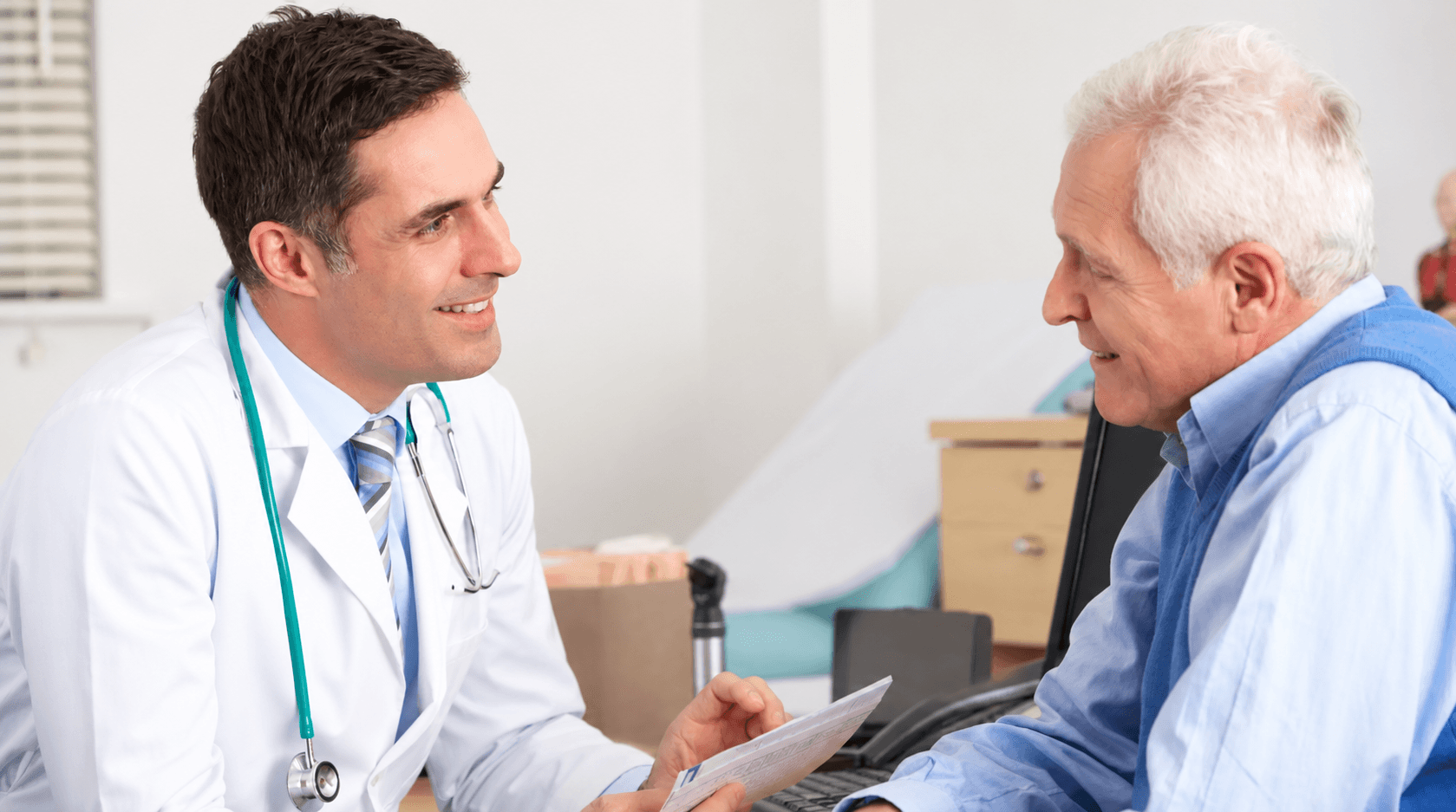 elderly male patient in consultation with a male doctor