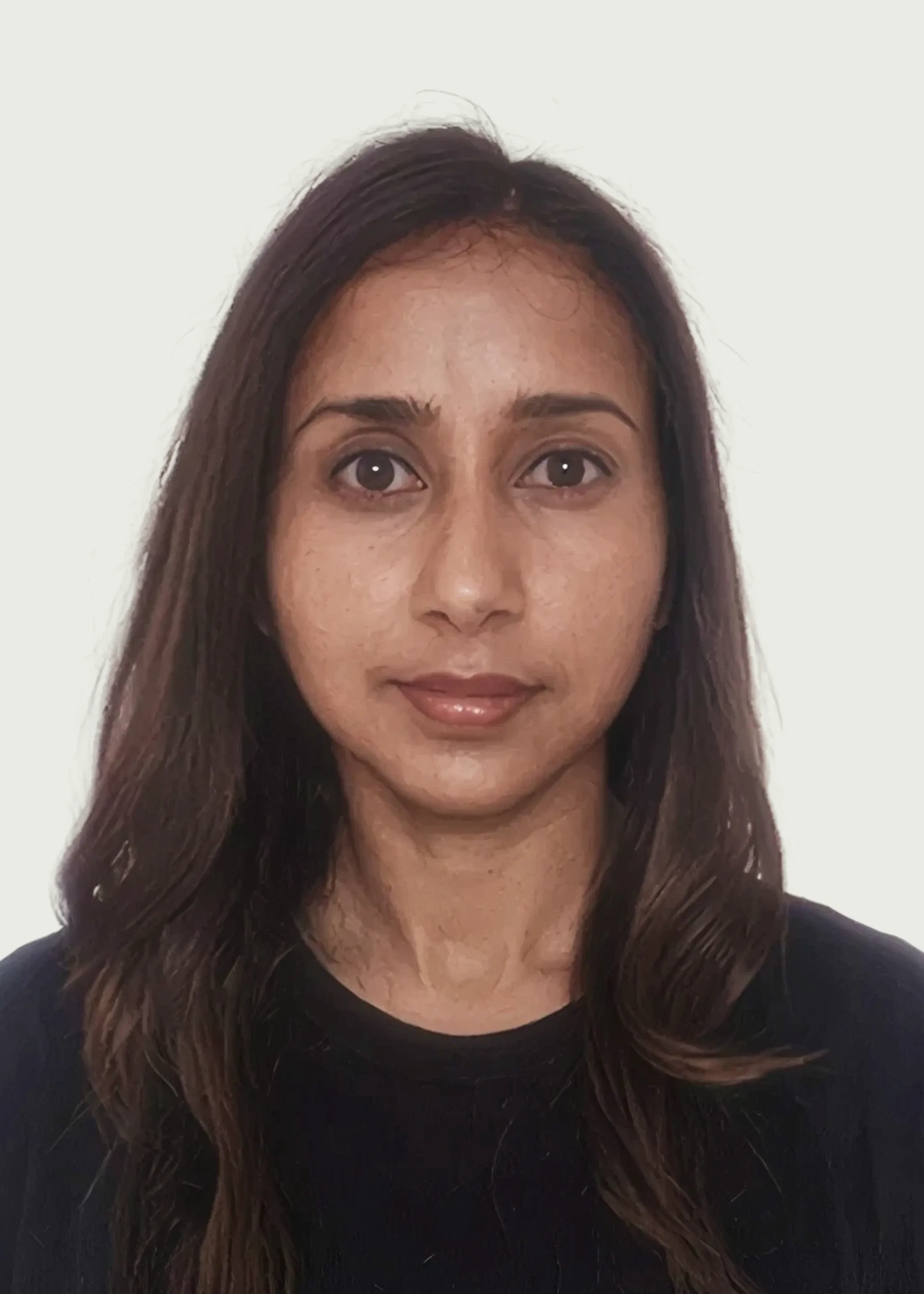 Professional headshot of female doctor wearing black top.